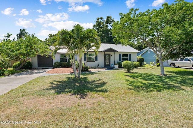1949 36th Ave, Vero Beach, FL 32960 - single story home with a garage, a front yard, driveway, and stucco siding