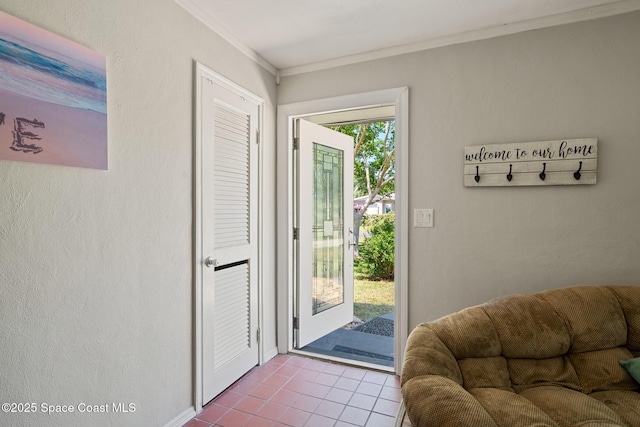 1949 36th Ave, Vero Beach, FL 32960 - doorway featuring tile patterned floors and crown molding