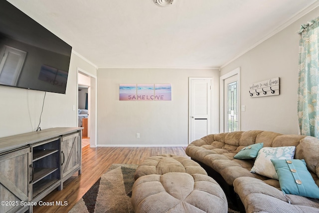 1949 36th Ave, Vero Beach, FL 32960 - living room featuring light wood-style flooring and ornamental molding