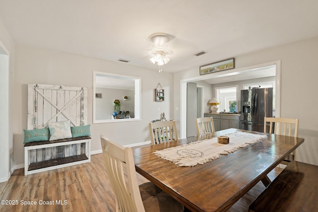 1949 36th Ave, Vero Beach, FL 32960 - dining area featuring wood finished floors and a ceiling fan