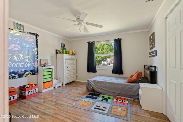 1949 36th Ave, Vero Beach, FL 32960 - bedroom with wood finished floors, ornamental molding, and ceiling fan