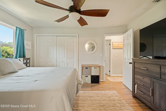 1949 36th Ave, Vero Beach, FL 32960 - bedroom featuring light wood-style floors, a closet, and a ceiling fan