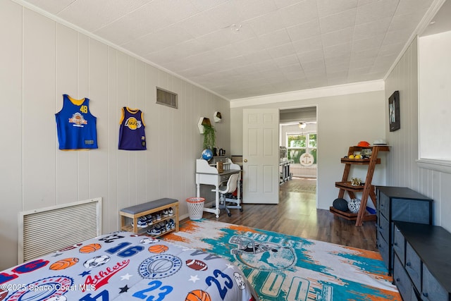 1949 36th Ave, Vero Beach, FL 32960 - bedroom with wood finished floors and crown molding
