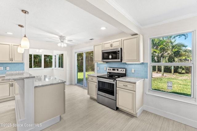 4060 Rhonda Ct, Merritt Island, FL 32952 - kitchen with appliances with stainless steel finishes, decorative backsplash, crown molding, light stone counters, and decorative light fixtures