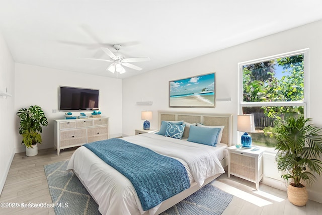 4060 Rhonda Ct, Merritt Island, FL 32952 - bedroom featuring light wood finished floors and a ceiling fan