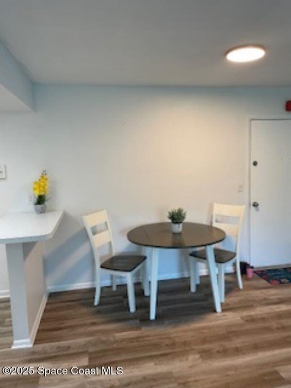 230 Columbia Dr Unit 208, Cape Canaveral, FL 32920 - dining room featuring wood finished floors and breakfast area