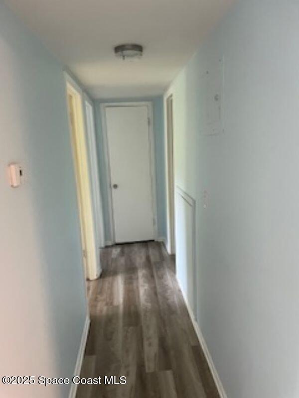 230 Columbia Dr Unit 208, Cape Canaveral, FL 32920 - corridor featuring wood finished floors and baseboards