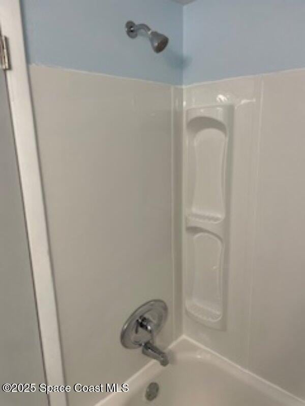 230 Columbia Dr Unit 208, Cape Canaveral, FL 32920 - bathroom featuring bathtub / shower combination