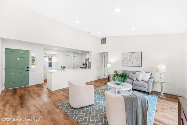 865 Southern Pine Trl, Rockledge, FL 32955 - living area featuring light wood-style flooring, recessed lighting, and vaulted ceiling