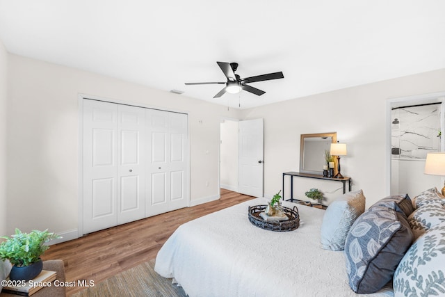 865 Southern Pine Trl, Rockledge, FL 32955 - bedroom with wood finished floors, a closet, and a ceiling fan