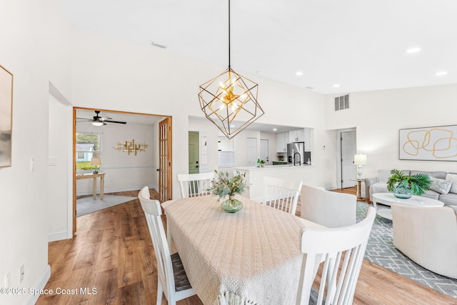 865 Southern Pine Trl, Rockledge, FL 32955 - dining area with light wood-type flooring, a chandelier, recessed lighting, and ceiling fan