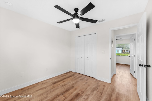 865 Southern Pine Trl, Rockledge, FL 32955 - unfurnished bedroom with light wood finished floors, a closet, and ceiling fan