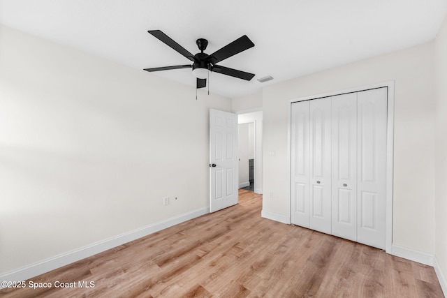 865 Southern Pine Trl, Rockledge, FL 32955 - unfurnished bedroom with light wood finished floors, a closet, and ceiling fan