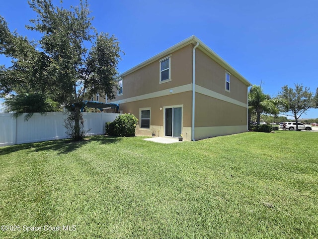 2735 Revolution St Unit 101, Melbourne, FL 32935 - rear view of house with stucco siding
