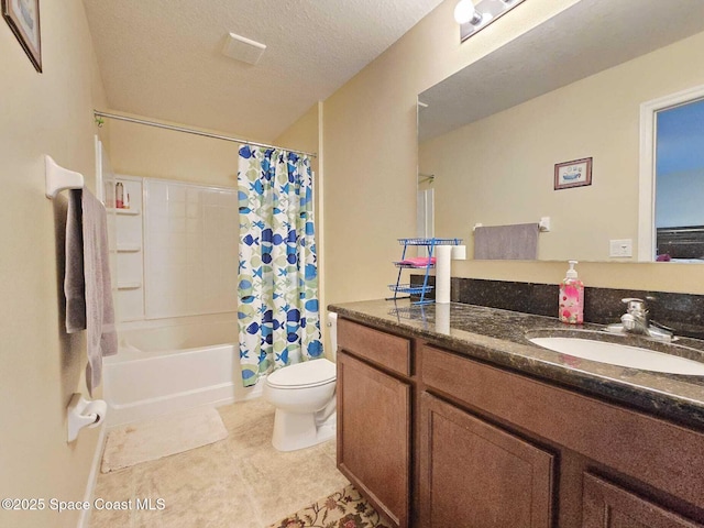 2735 Revolution St Unit 101, Melbourne, FL 32935 - bathroom featuring vanity, shower / bath combo with shower curtain, tile patterned flooring, and a textured ceiling
