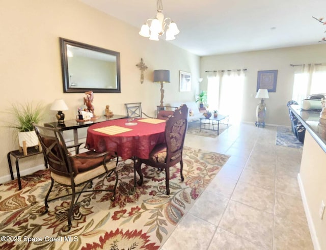 2735 Revolution St Unit 101, Melbourne, FL 32935 - dining area with a chandelier, plenty of natural light, and tile patterned flooring