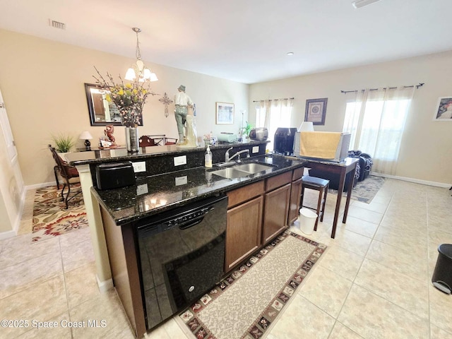 2735 Revolution St Unit 101, Melbourne, FL 32935 - kitchen featuring black dishwasher, light tile patterned floors, a center island with sink, a chandelier, and dark stone countertops