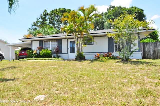 2938 Chipper Dr NE, Palm Bay, FL 32905 - ranch-style home featuring a carport