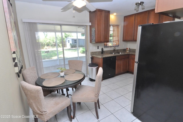 2938 Chipper Dr NE, Palm Bay, FL 32905 - kitchen featuring freestanding refrigerator, black dishwasher, brown cabinets, ceiling fan, and light tile patterned floors