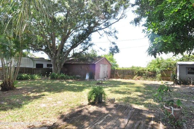 2938 Chipper Dr NE, Palm Bay, FL 32905 - fenced backyard with a storage unit and a deck