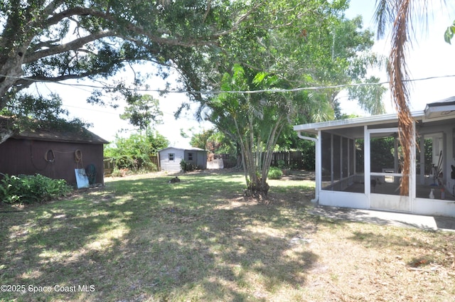 2938 Chipper Dr NE, Palm Bay, FL 32905 - view of yard featuring a shed and a sunroom