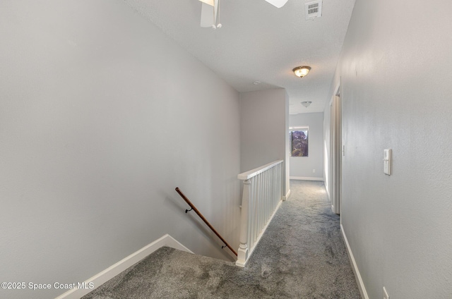 1250 Admiralty Blvd, Rockledge, FL 32955 - corridor featuring an upstairs landing and carpet flooring