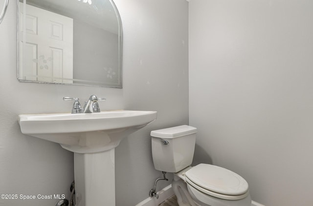 1250 Admiralty Blvd, Rockledge, FL 32955 - half bathroom with baseboards and toilet