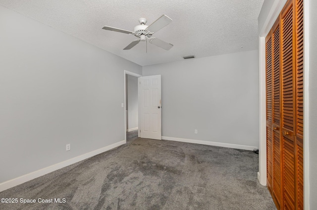 1250 Admiralty Blvd, Rockledge, FL 32955 - unfurnished bedroom with a closet, carpet floors, a textured ceiling, and ceiling fan