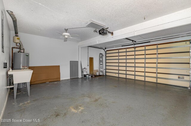 1250 Admiralty Blvd, Rockledge, FL 32955 - garage featuring a garage door opener, water heater, and ceiling fan