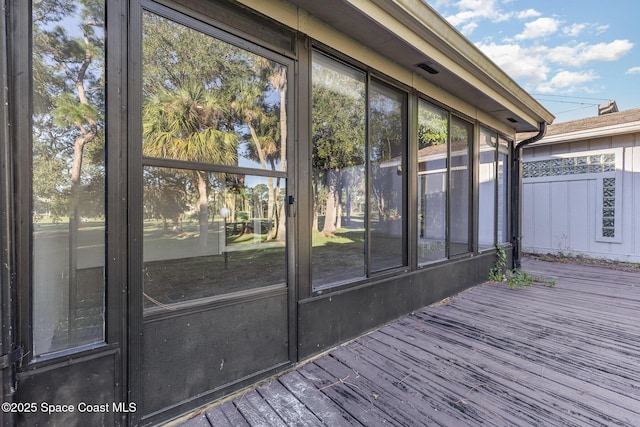 1250 Admiralty Blvd, Rockledge, FL 32955 - wooden deck with a sunroom