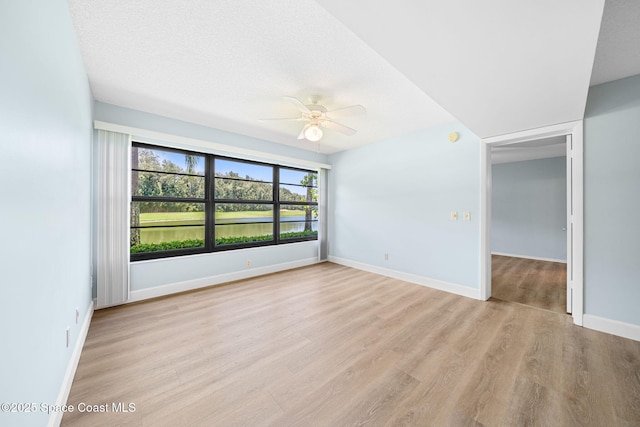 14 Plantation Dr Unit 103, Vero Beach, FL 32966 - unfurnished room featuring a ceiling fan and light wood-style floors