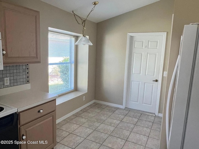 2324 Addington Cir, Rockledge, FL 32955 - unfurnished dining area with baseboards and light tile patterned flooring