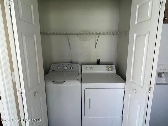 2324 Addington Cir, Rockledge, FL 32955 - washroom featuring washing machine and clothes dryer
