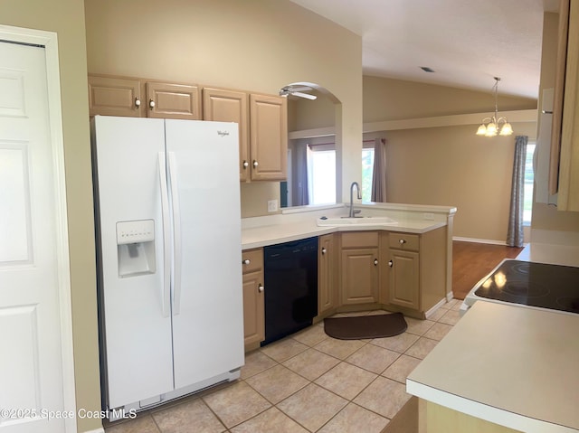 2324 Addington Cir, Rockledge, FL 32955 - kitchen featuring white fridge with ice dispenser, black dishwasher, vaulted ceiling, light brown cabinetry, and light countertops