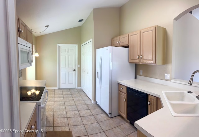 2324 Addington Cir, Rockledge, FL 32955 - kitchen featuring white appliances, vaulted ceiling, arched walkways, light brown cabinetry, and light countertops