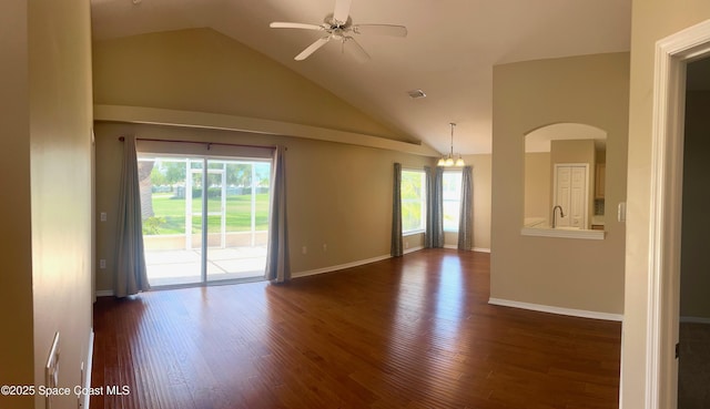 2324 Addington Cir, Rockledge, FL 32955 - spare room with dark wood-type flooring, ceiling fan, arched walkways, and high vaulted ceiling