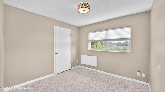 2009 Vaughn St, Titusville, FL 32796 - spare room featuring baseboards and a textured ceiling