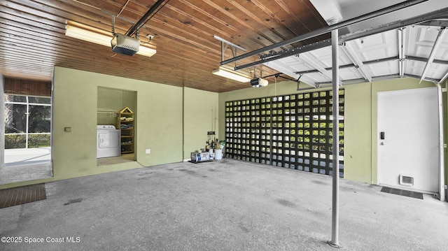 2009 Vaughn St, Titusville, FL 32796 - garage featuring washer / clothes dryer and a garage door opener
