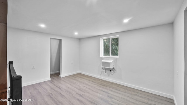2009 Vaughn St, Titusville, FL 32796 - spare room with wood finished floors, recessed lighting, and a wall unit AC