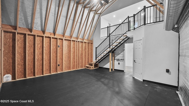 2009 Vaughn St, Titusville, FL 32796 - unfurnished living room featuring a towering ceiling and stairway