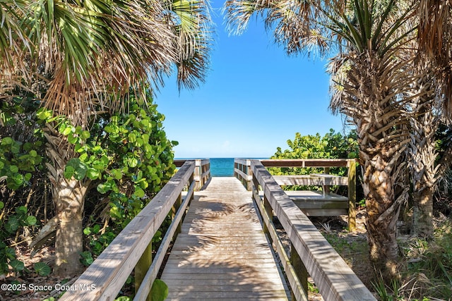 712 Sea Palm Ln, Satellite Beach, FL 32937 - dock featuring view of water and beach
