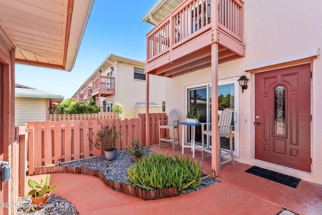 712 Sea Palm Ln, Satellite Beach, FL 32937 - entrance to property with a balcony, stucco siding, and a patio