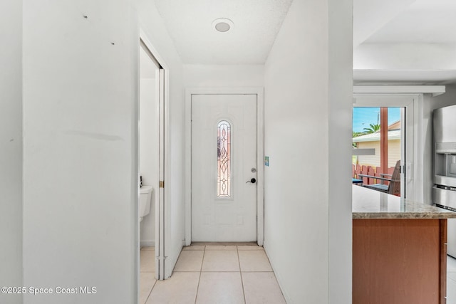 712 Sea Palm Ln, Satellite Beach, FL 32937 - doorway featuring light tile patterned floors