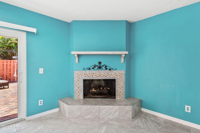 712 Sea Palm Ln, Satellite Beach, FL 32937 - tiled living room featuring a tile fireplace and a textured ceiling