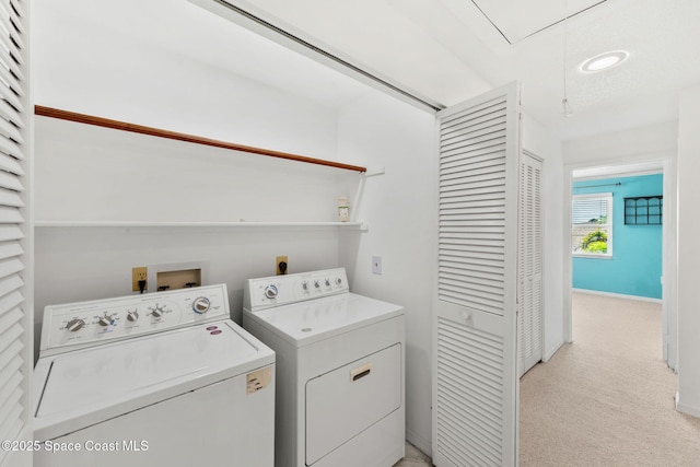 712 Sea Palm Ln, Satellite Beach, FL 32937 - washroom with washing machine and dryer, attic access, and light colored carpet