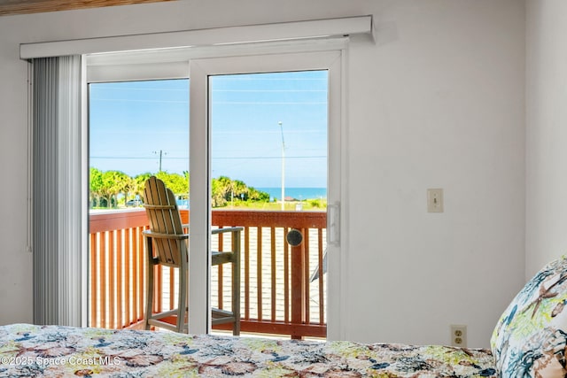 712 Sea Palm Ln, Satellite Beach, FL 32937 - bedroom featuring multiple windows and access to exterior