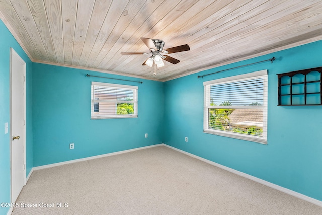 712 Sea Palm Ln, Satellite Beach, FL 32937 - carpeted spare room featuring wooden ceiling, ceiling fan, and ornamental molding