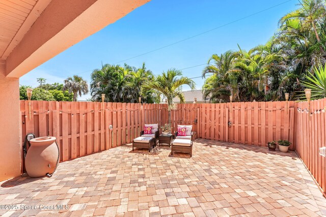 712 Sea Palm Ln, Satellite Beach, FL 32937 - fenced backyard featuring a patio area