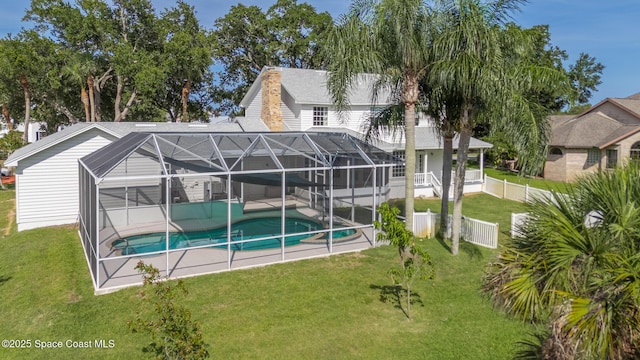 2123 Royal Oaks Dr, Rockledge, FL 32955 - back of house with an outdoor pool, a patio, and glass enclosure