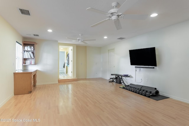 2123 Royal Oaks Dr, Rockledge, FL 32955 - unfurnished living room with a ceiling fan, light wood-type flooring, and recessed lighting